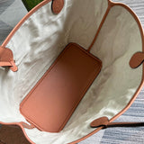 Side profile of modern everyday-luxe women's handbag – women's luxury accessory