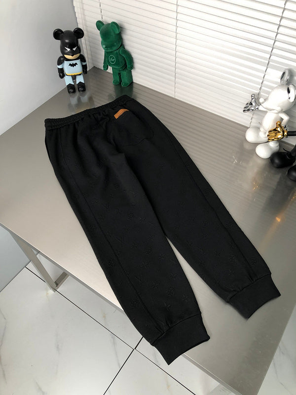 Flat lay presentation of Louis Vuitton luxury clothing with tailored silhouette