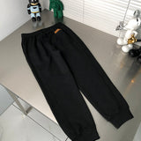 Flat lay presentation of Louis Vuitton luxury clothing with tailored silhouette