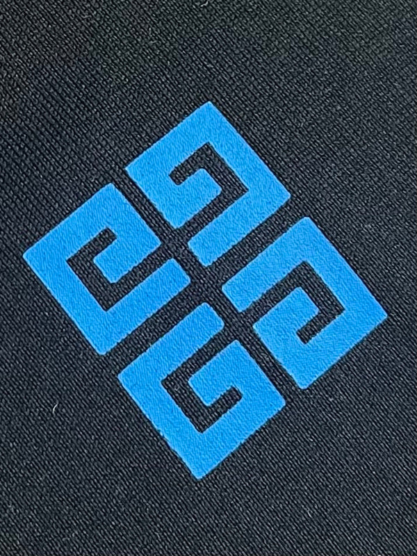 Close-up detail shot of Givenchy luxury clothing with streetwear-inspired cut
