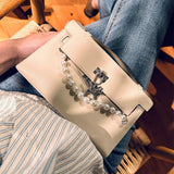  Polished handbag carried on shoulder