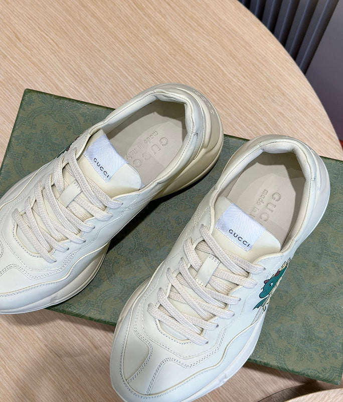 Side profile of Gucci fresh white-and-black sneakers streetwear statement look