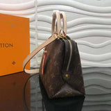 Close-up detail of signature structured women's handbag – women's designer-style accessory