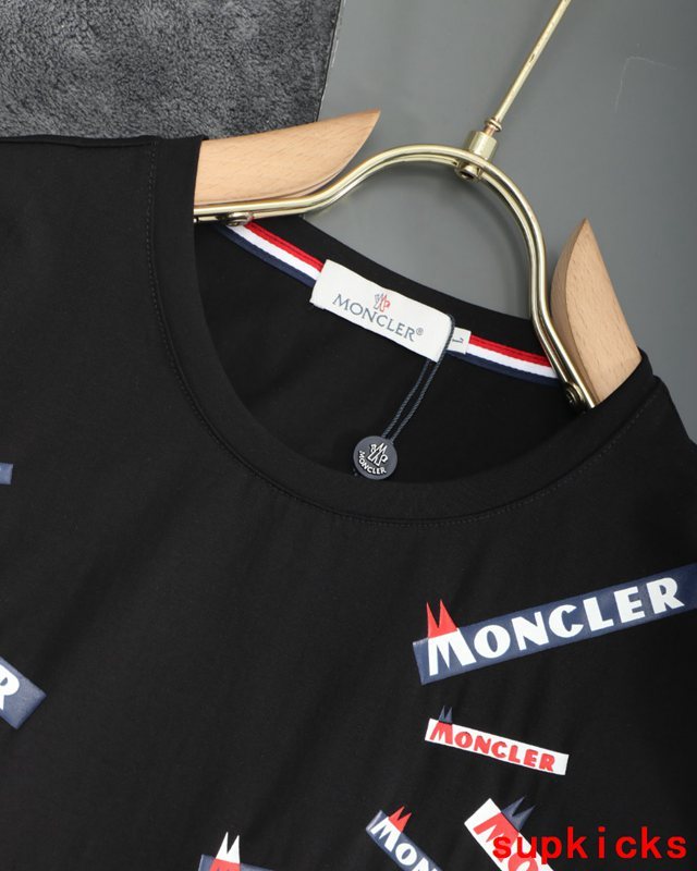 Flat lay presentation of Moncler luxury clothing with tailored silhouette