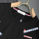 Flat lay presentation of Moncler luxury clothing with tailored silhouette