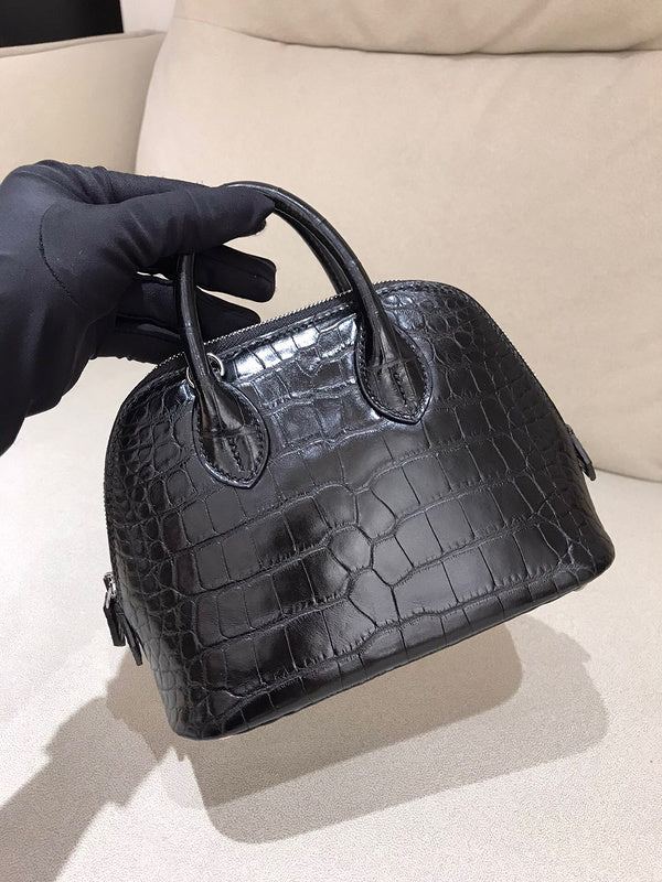 Side view of sleek structured handbag