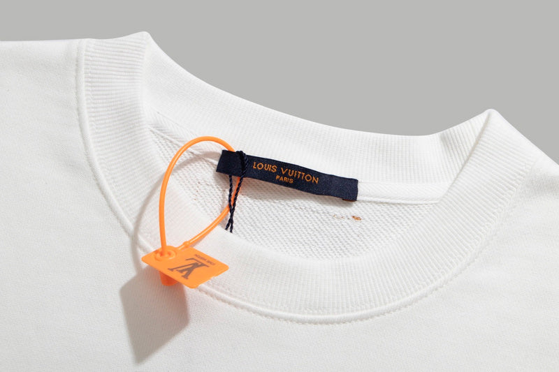 Close-up detail shot of Louis Vuitton luxury clothing with signature branding