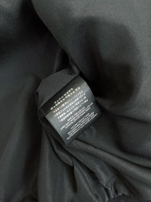 Front view of Gucci luxury clothing with logo-detail design