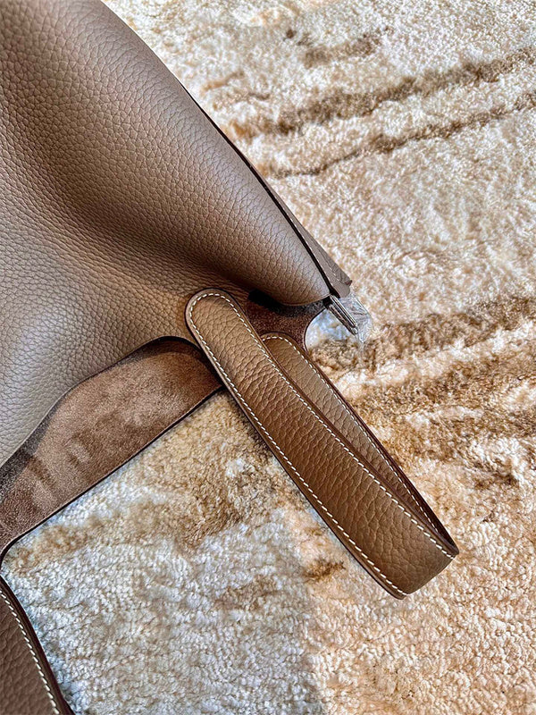  Tailored shoulder bag carried on shoulder 16