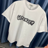 Side profile of Givenchy luxury clothing with monogram-inspired silhouette