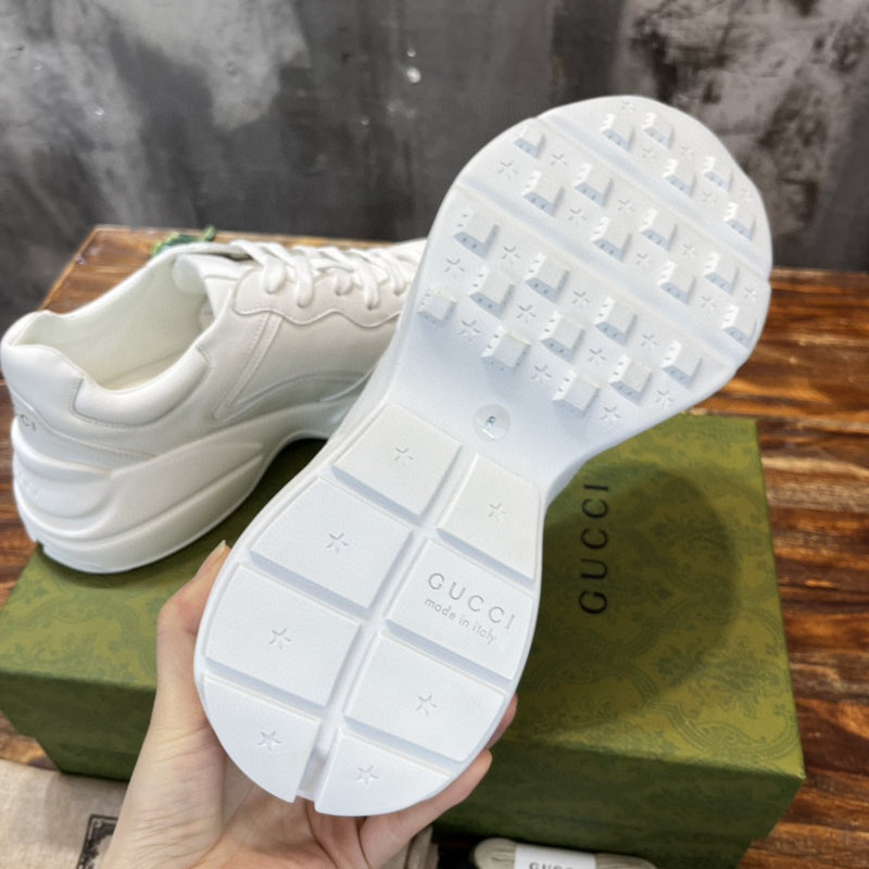 Side profile of Gucci all-black sneakers low-top design
