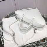 Styled lifestyle shot of chic polished women's handbag – women's designer-style accessory