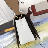 Styled lifestyle shot of everyday-luxe signature women's handbag – women's designer-style accessory