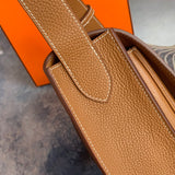 Side view of sleek structured handbag