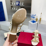 Three-quarter angle view of Valentino Garavani luxury piece style No.242