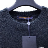 Flat lay presentation of Louis Vuitton luxury clothing with relaxed-fit cut
