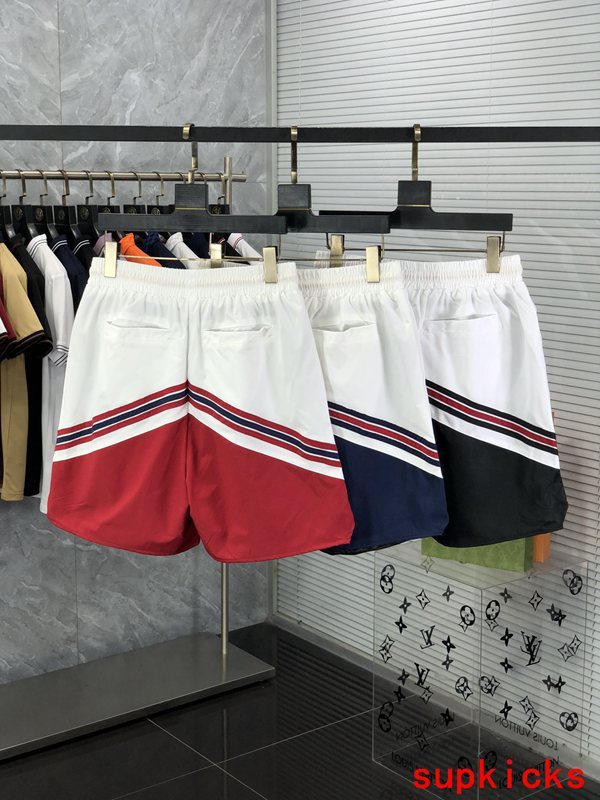 Flat lay presentation of Rhude luxury clothing with label-forward styling