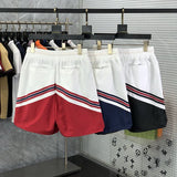 Flat lay presentation of Rhude luxury clothing with label-forward styling