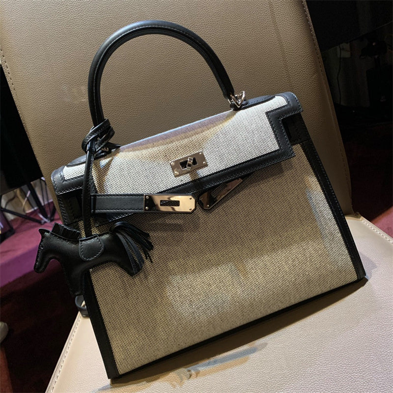 Side view of minimalist structured handbag