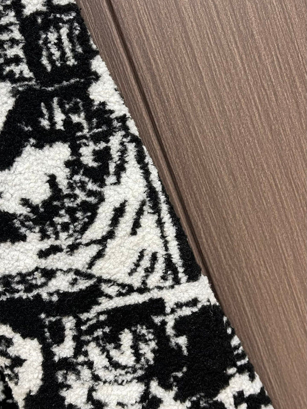 Close-up detail shot of Louis Vuitton luxury clothing with logo-detail design