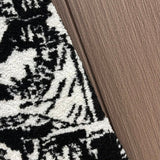Close-up detail shot of Louis Vuitton luxury clothing with logo-detail design