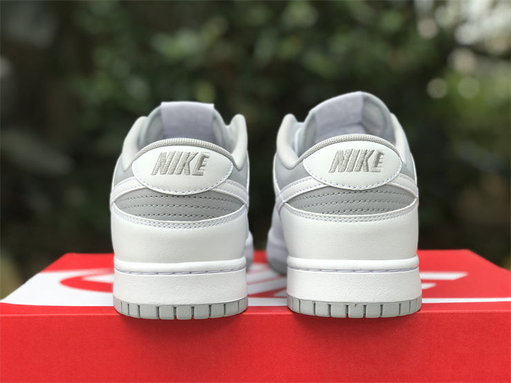 Side profile of Nike two-tone sneakers signature lace-up style