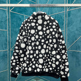 Side profile of Louis Vuitton luxury clothing with logo-detail design