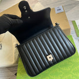 Close-up detail of structured polished women's handbag – women's statement bag