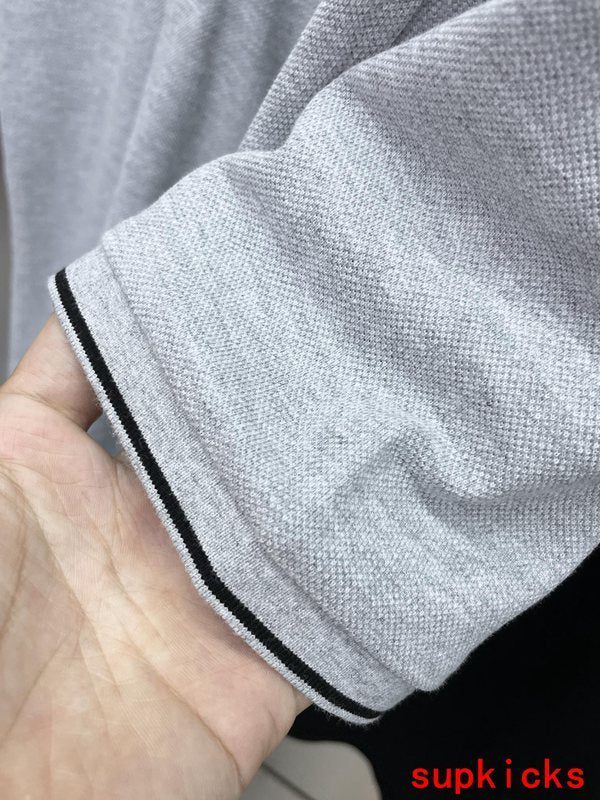 Front view of Moncler luxury clothing with logo-detail design