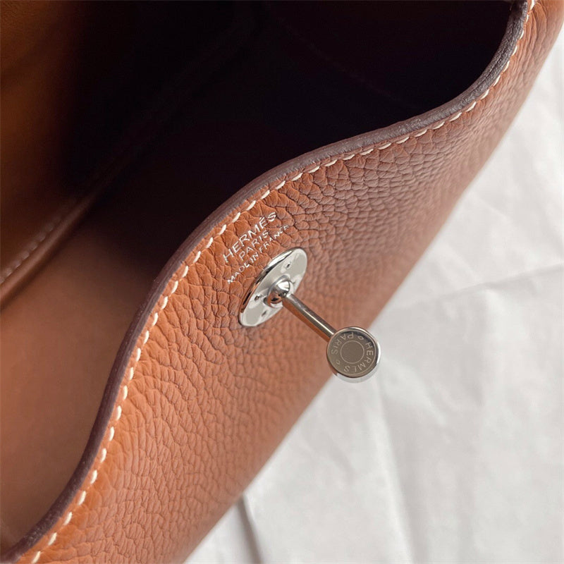  Understated satchel carried on shoulder