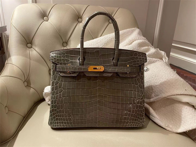 Side view of curated structured handbag