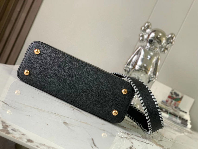Styled lifestyle shot of everyday-luxe signature women's handbag – women's luxury handbag