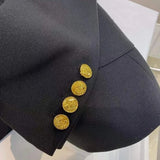 Side profile of Louis Vuitton luxury clothing with logo-detail design