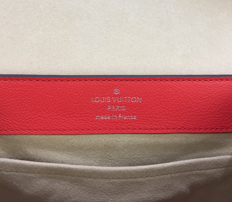 Side profile of polished refined women's handbag – women's statement bag
