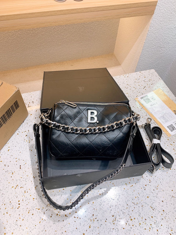 Ziva's Charm handbag – side angle view (one versatile size)