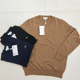 Side profile of Lacoste luxury clothing with monogram-inspired silhouette