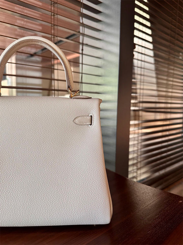 Side view of classic structured handbag