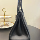 Side view of effortless structured handbag