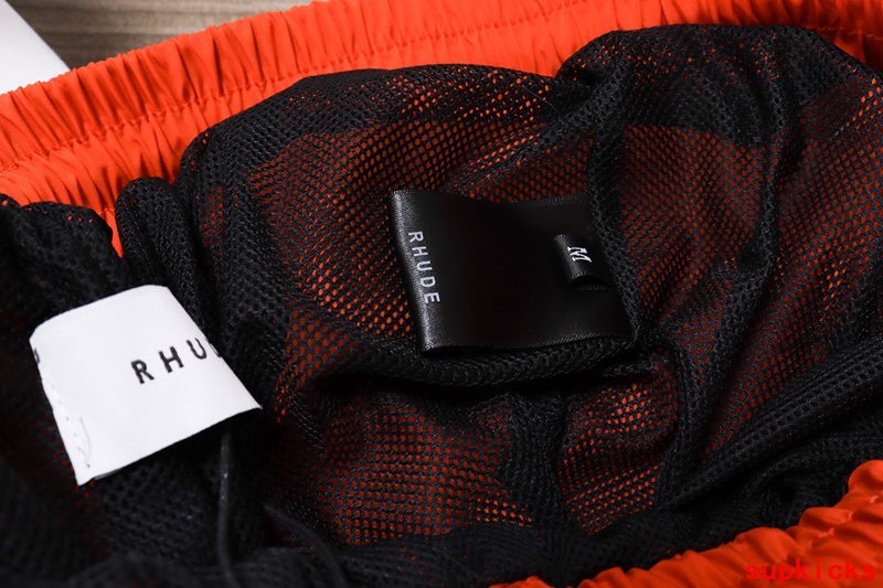 Side profile of Rhude luxury clothing with monogram-inspired silhouette