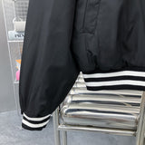 Back view of Louis Vuitton luxury clothing with label-forward styling