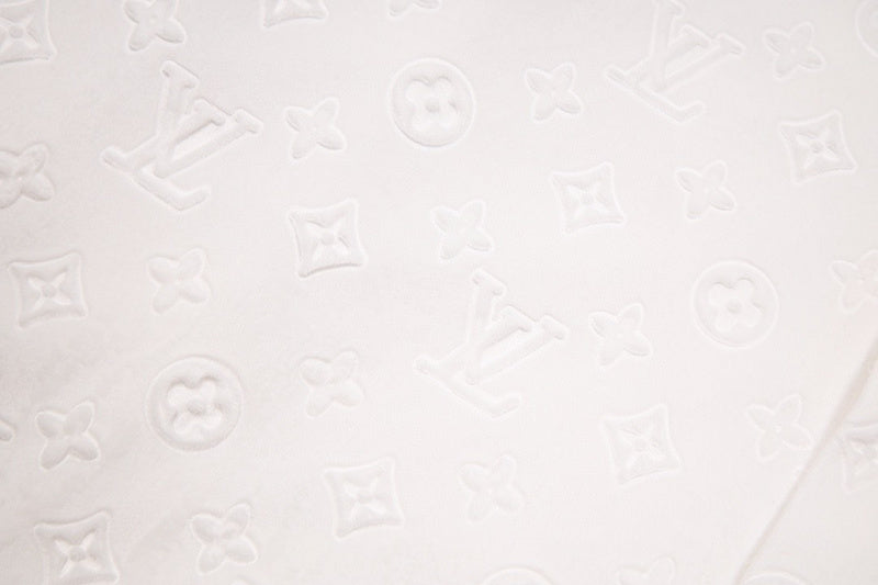 Side profile of Louis Vuitton luxury clothing with logo-detail design