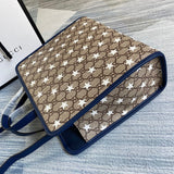 Handle and strap detail of statement signature women's handbag – women's everyday handbag