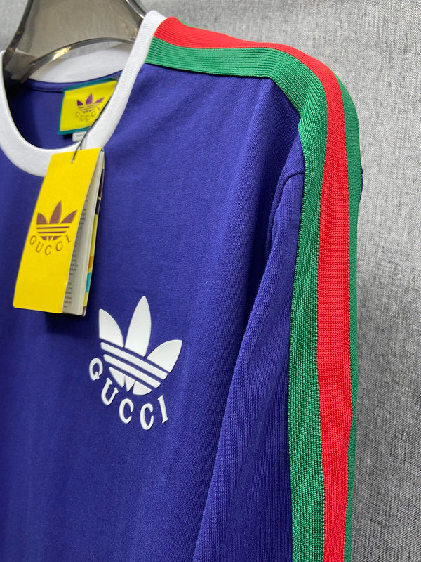 Flat lay presentation of Gucci luxury clothing with logo-detail design