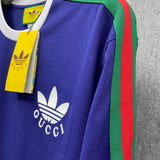 Flat lay presentation of Gucci luxury clothing with logo-detail design