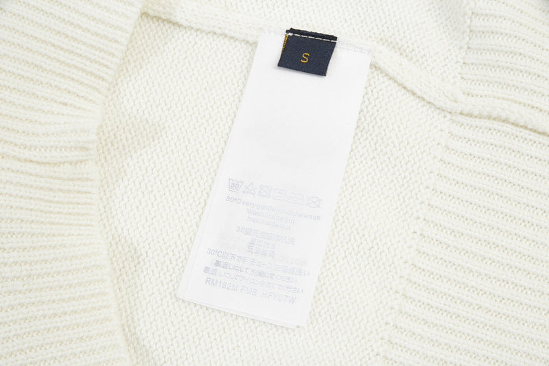Close-up detail shot of Louis Vuitton luxury clothing with runway-inspired design