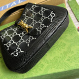 Styled lifestyle shot of sleek refined women's handbag – women's luxury handbag