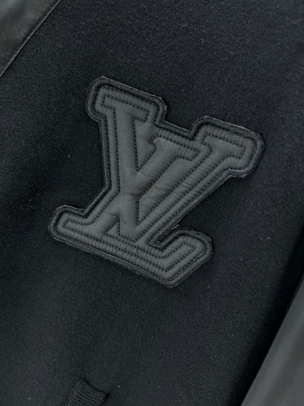 Flat lay presentation of Louis Vuitton luxury clothing with runway-inspired design