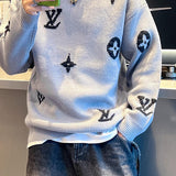 Flat lay presentation of Louis Vuitton luxury clothing with monogram-inspired silhouette