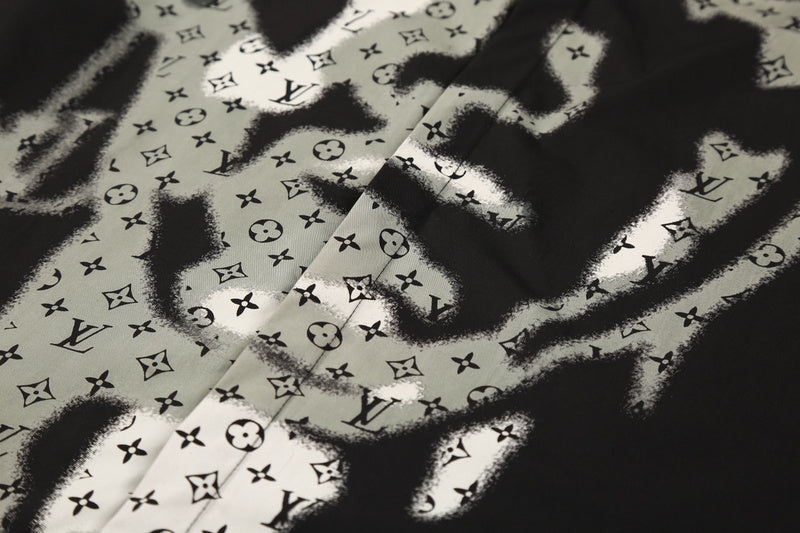 Close-up detail shot of Louis Vuitton luxury clothing with logo-detail design