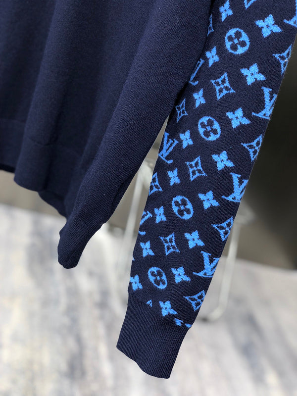 Flat lay presentation of Louis Vuitton luxury clothing with tailored silhouette
